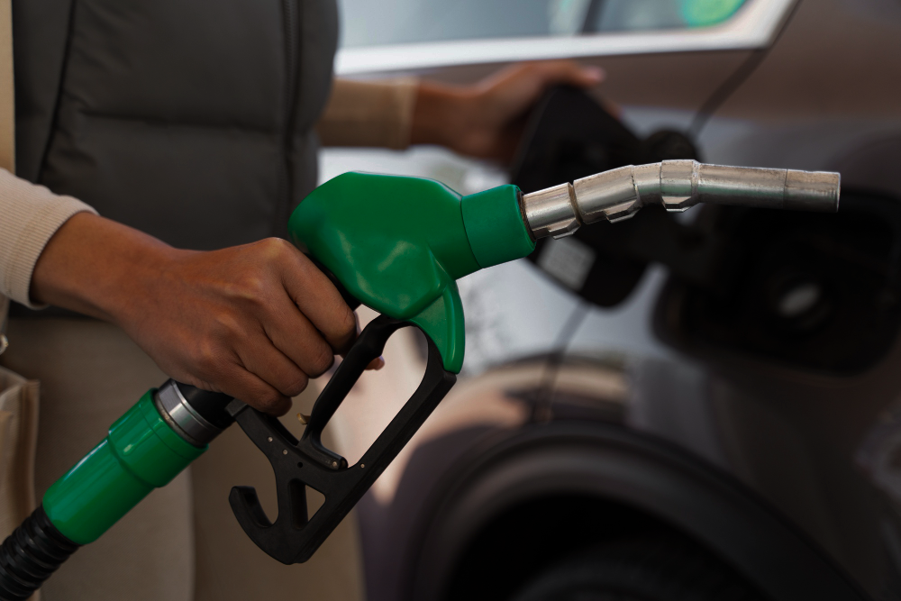 view-woman-with-car-gas-station 1